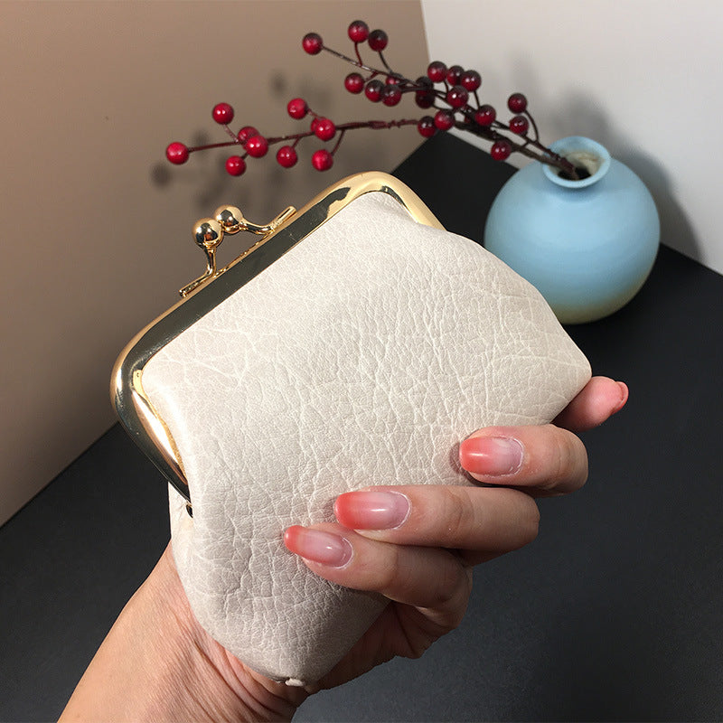 Lady nude leather coin bag (must take 200)